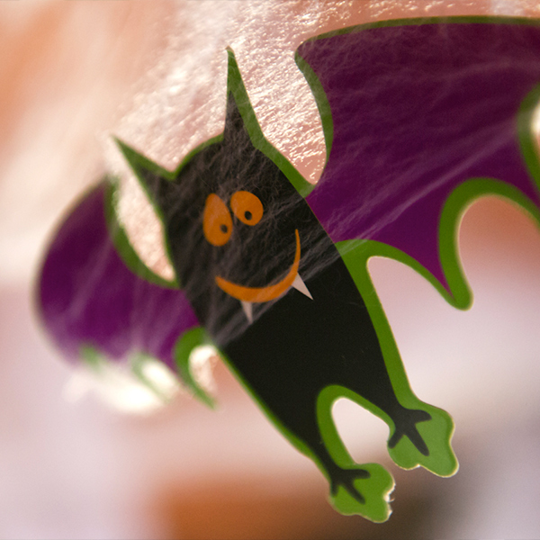 A halloween decoration shaped like a smiling bat