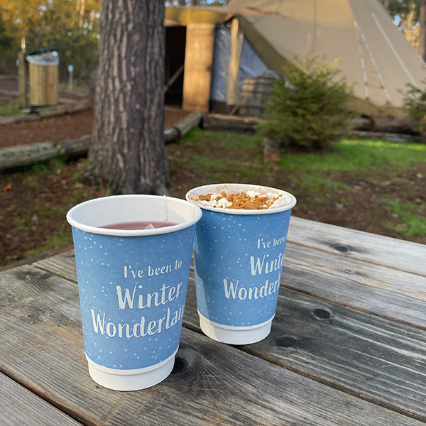 Two light blue Winter Wonderland cups with mulled mine and hot chocolate