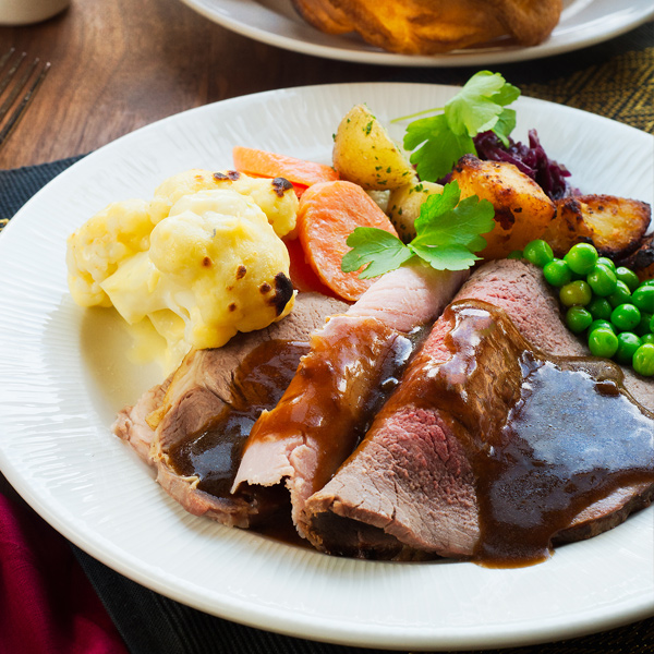 A mixed meat roast dinner with gravy