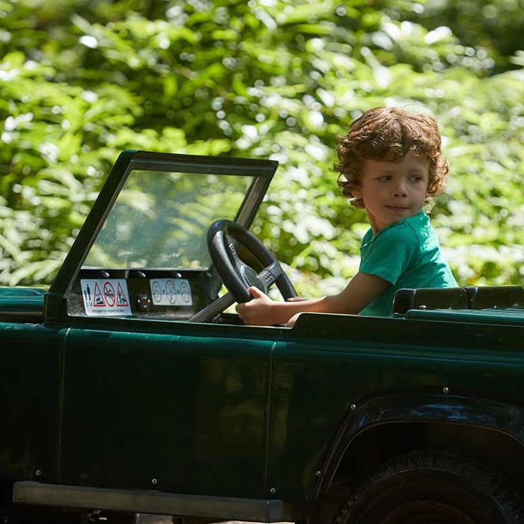 A little boy drives a minature 4 x 4 in Off-Road Explorers