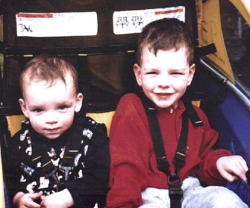 Image of Aimee and her brother in a Cycle attachment in 1997