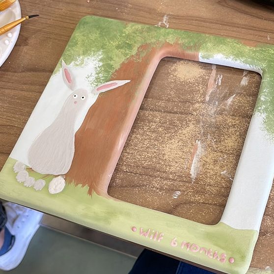 Image of the pottery painting picture frame with Wilfs footprint being turned into a bunny