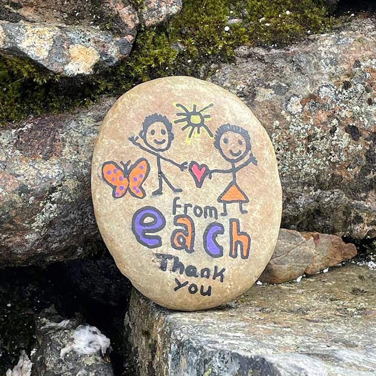 A pebble with drawings on it