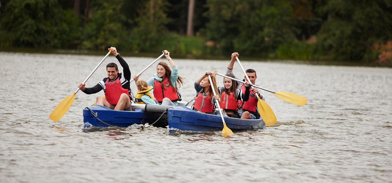 Group on Katakanu paddling across lake