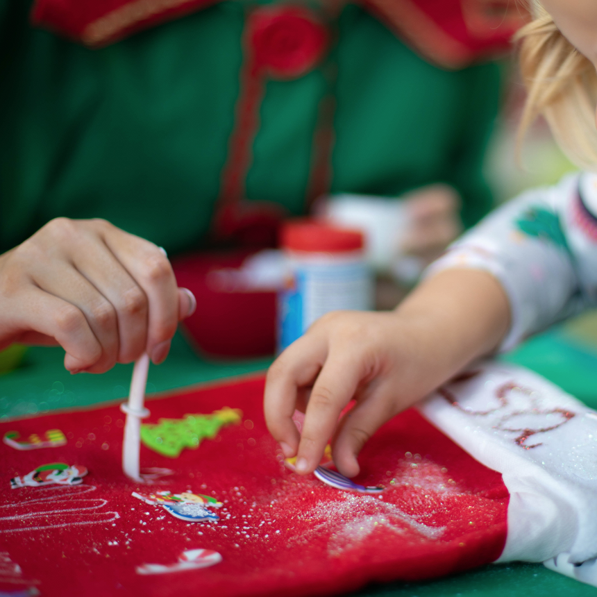 Children decorating a stocking