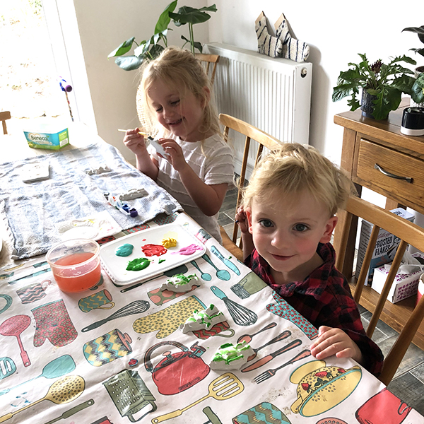 Children at a table painting