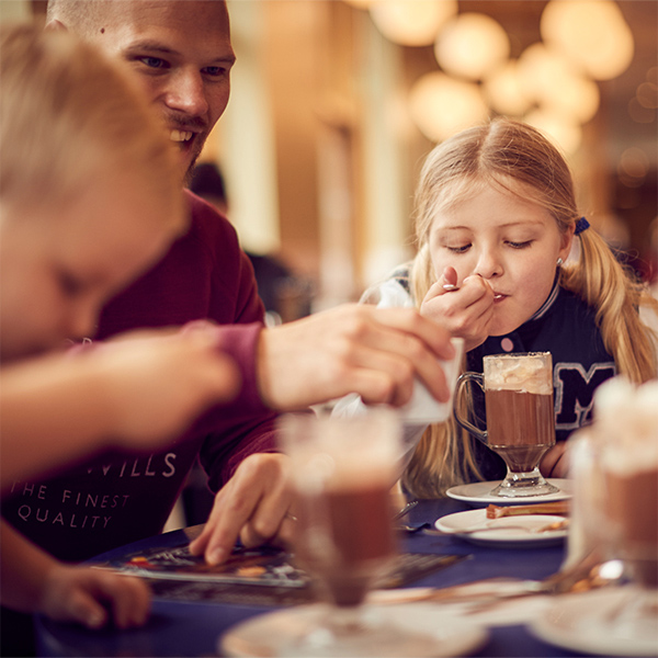 Girl enjoys hot chocolate at the Pancake House