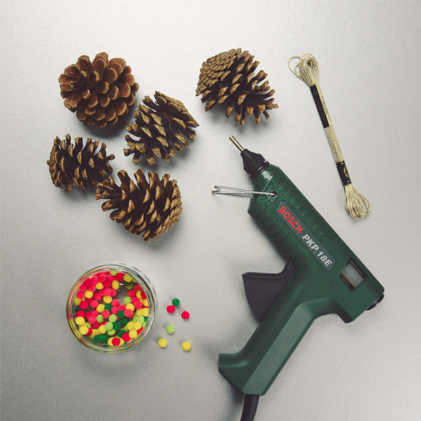 Pine cones, glue gun and decorations
