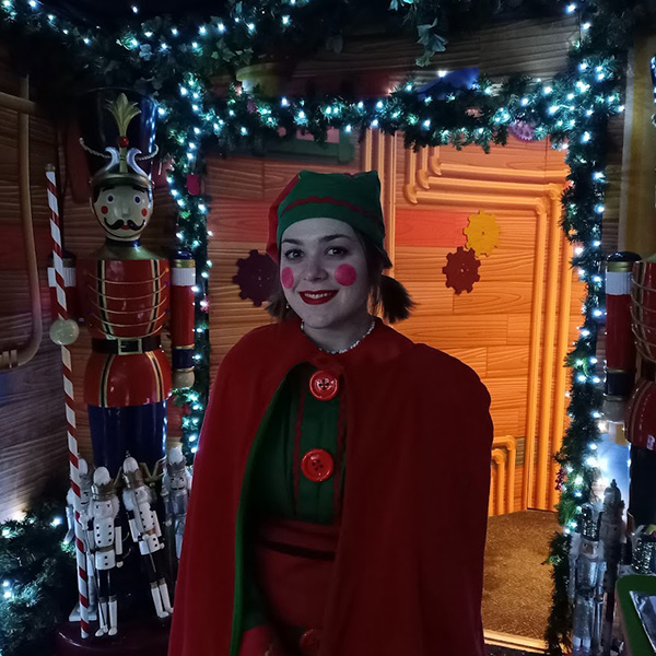 Fawn the elf stood in Santa's Woodland Workshop 