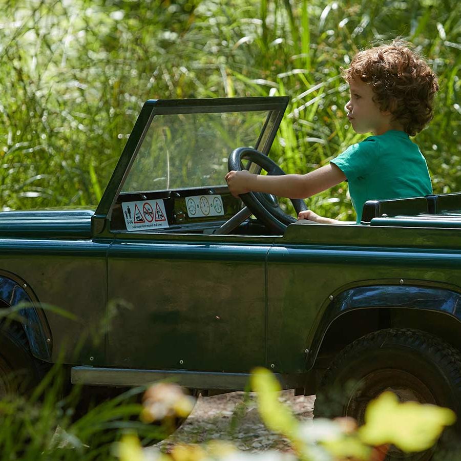 Child in mini explorers Jeep
