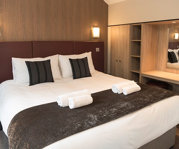 A double bed in one of our Hotel or Apartment rooms