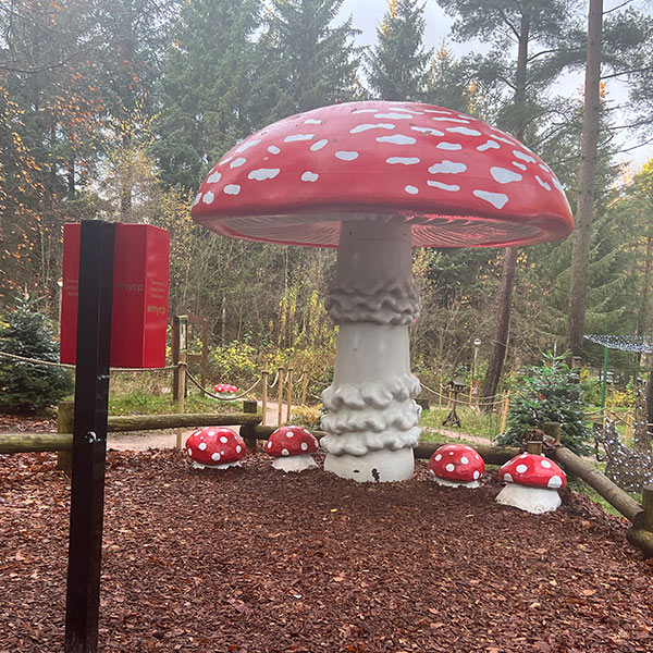 giant red toadstool photo opportunity with phone box phone holder