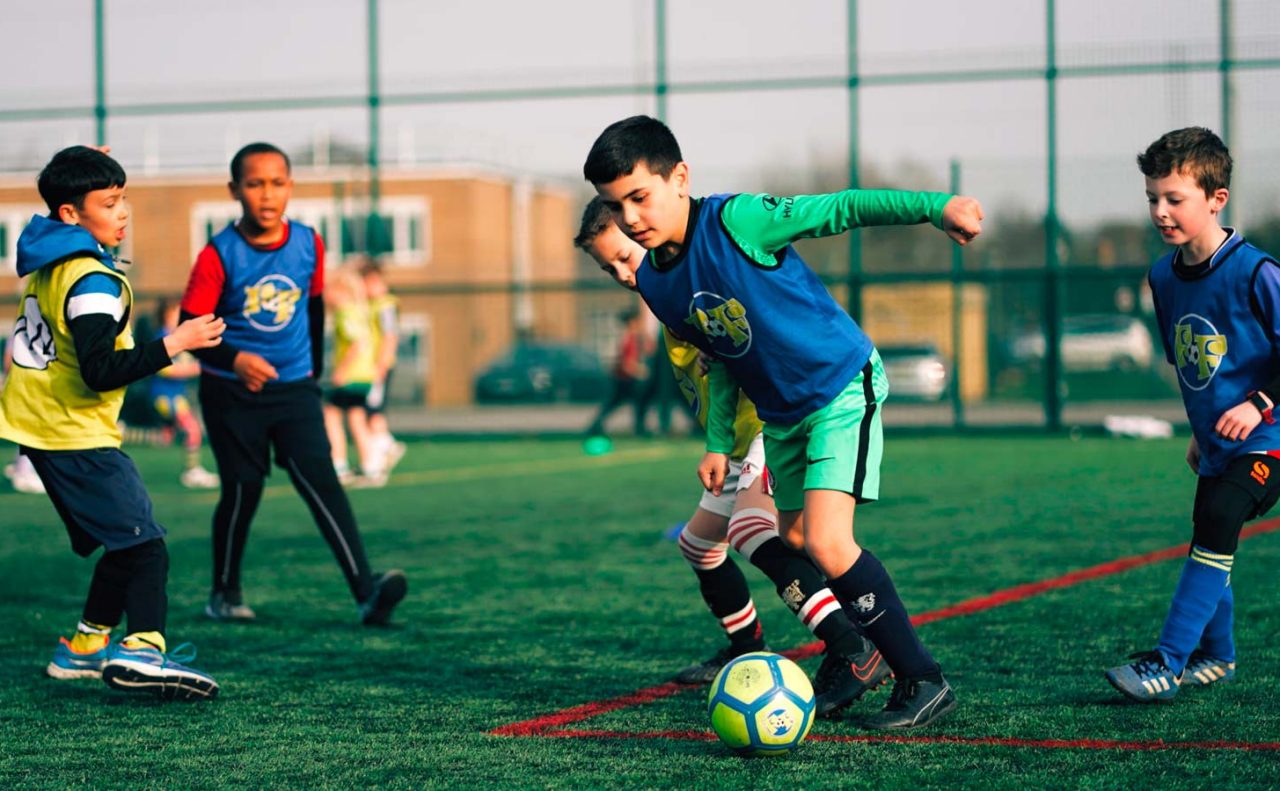 A group of young boys playing football