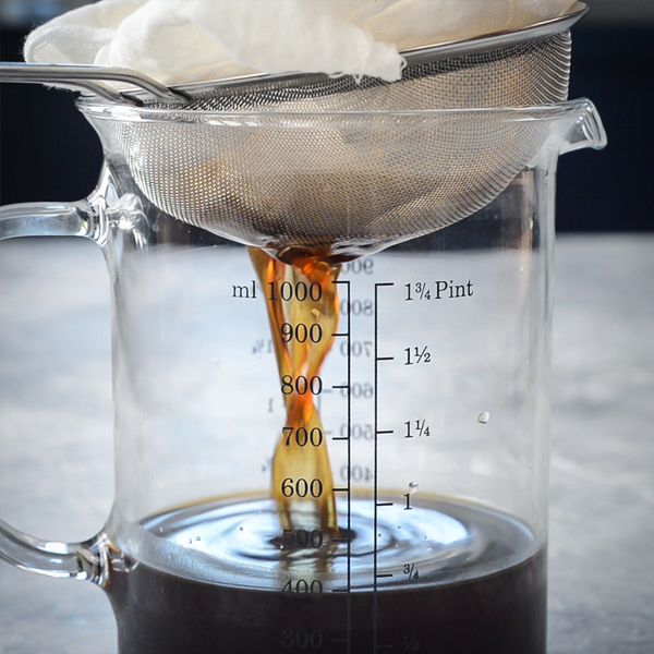 Coffee straining into measuring jug