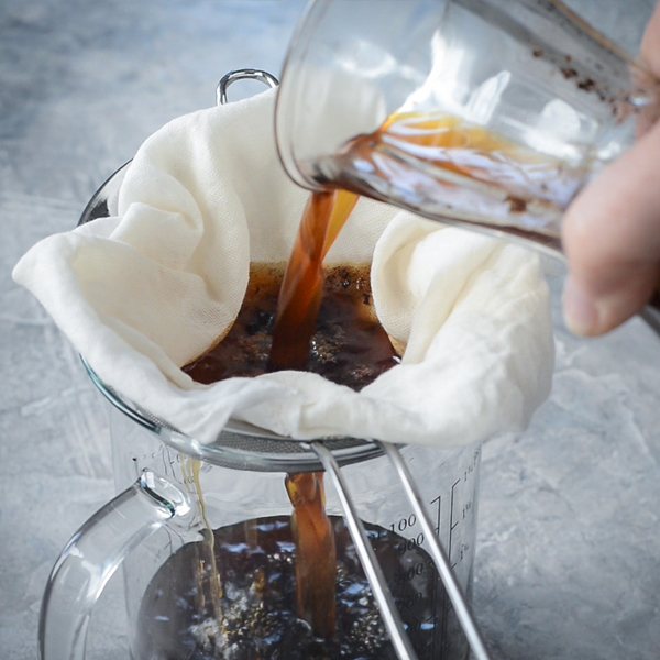 Coffee being poured into strainer