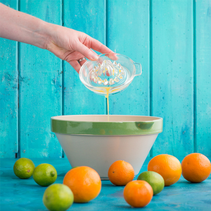 Pouring juice into mixing bowl