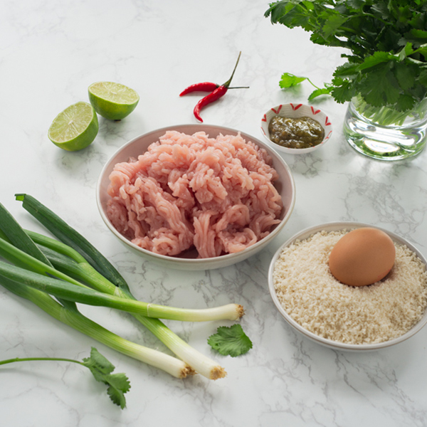 The ingredients for thai bites laid out in bowls.
