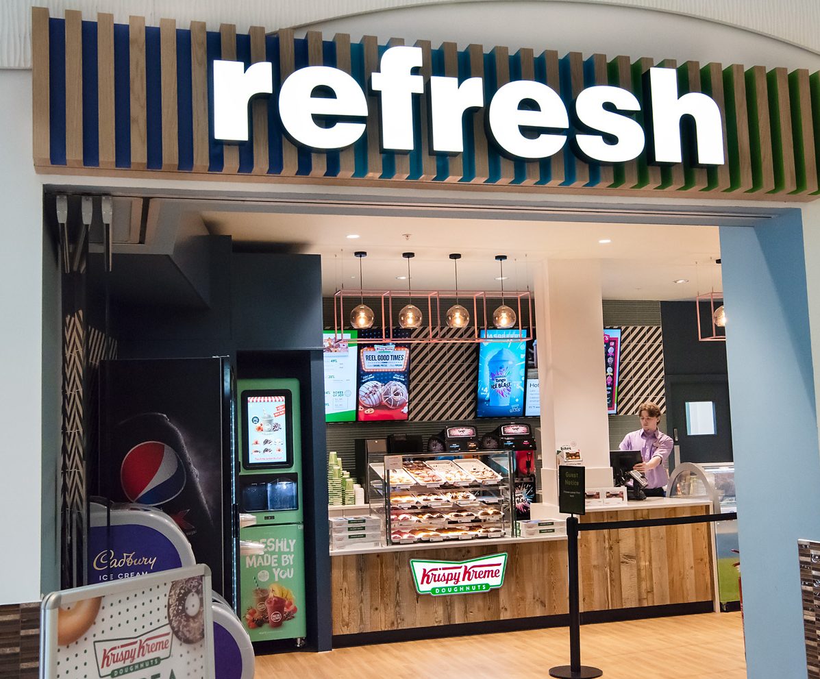 Our new Cafe Refresh, outside the cafe with an illuminated sign 'Refresh'