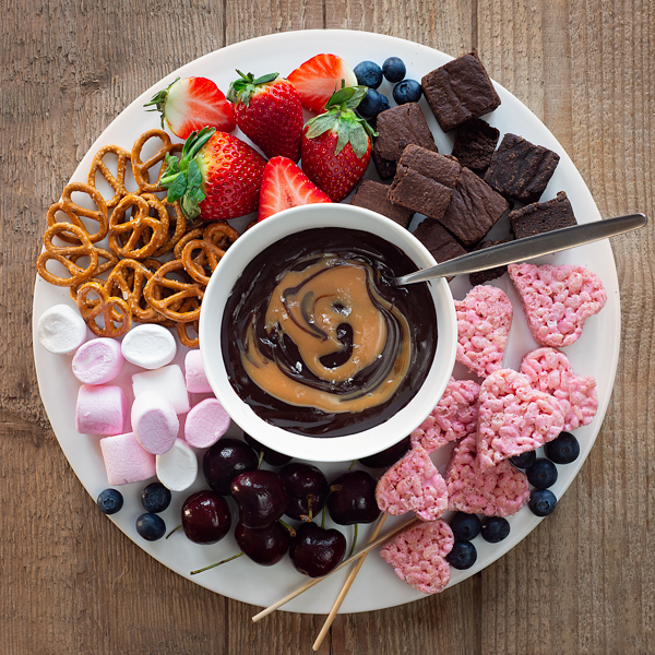 Salted caramel and chocolate fondue with marshmallow crispy hearts