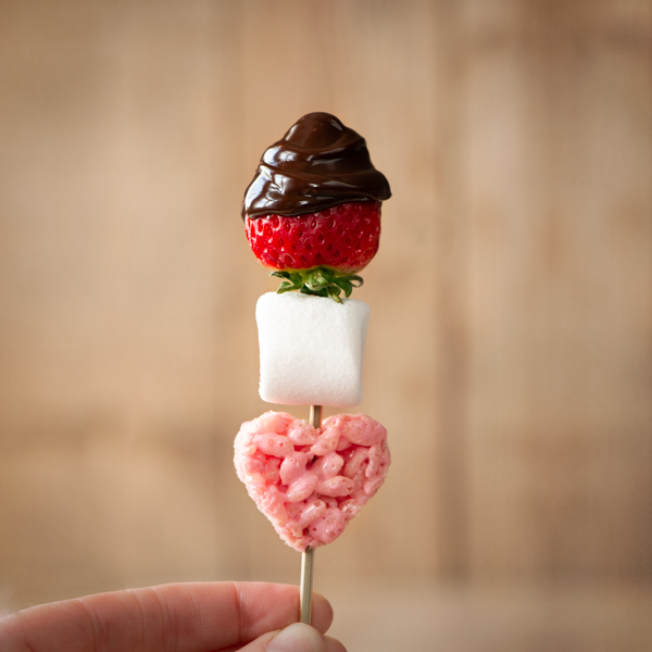Strawberries, marshmallow and rice crispy heart dipped in chocolate