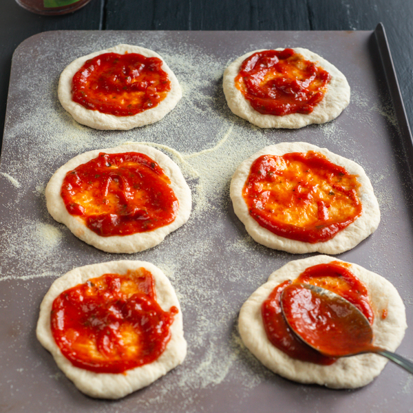 Mini pizzas with tomato base on a tray