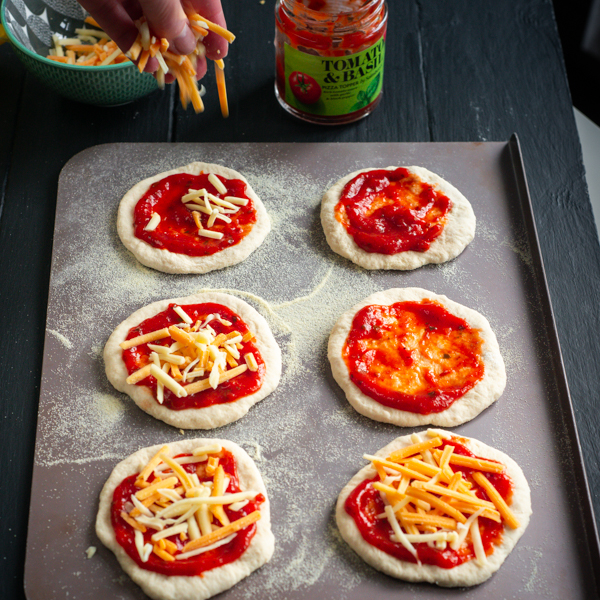 Cheese and tomato pizza bases