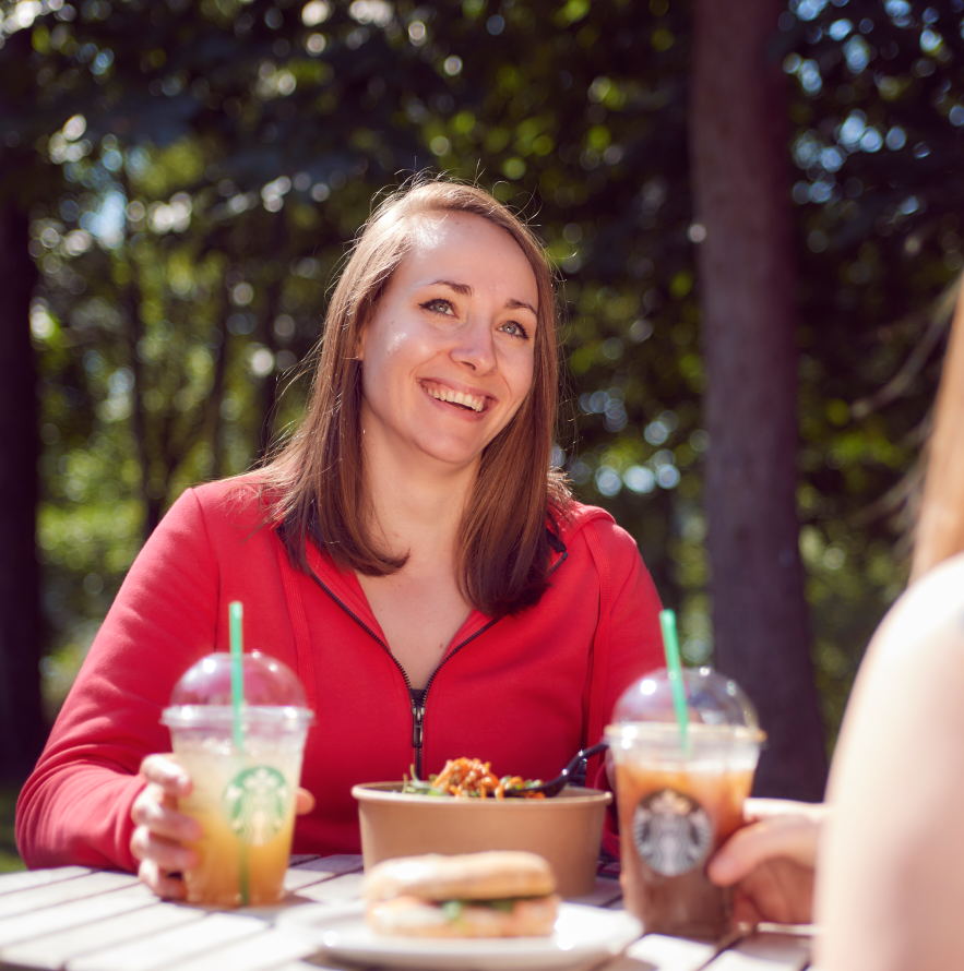 Women socialise with Starbuck's coffee