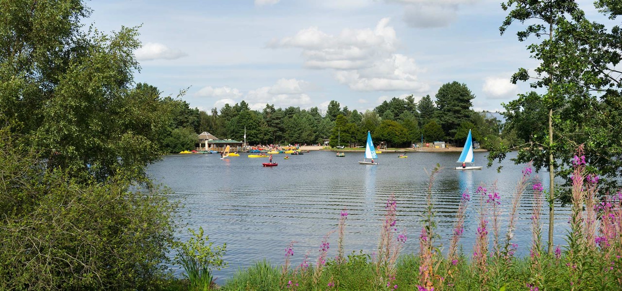 View across lake with water sports taking place