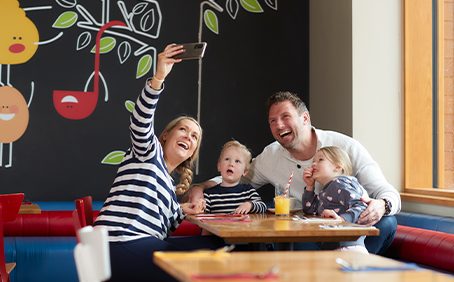 A family in The Pancake House taking a selfie