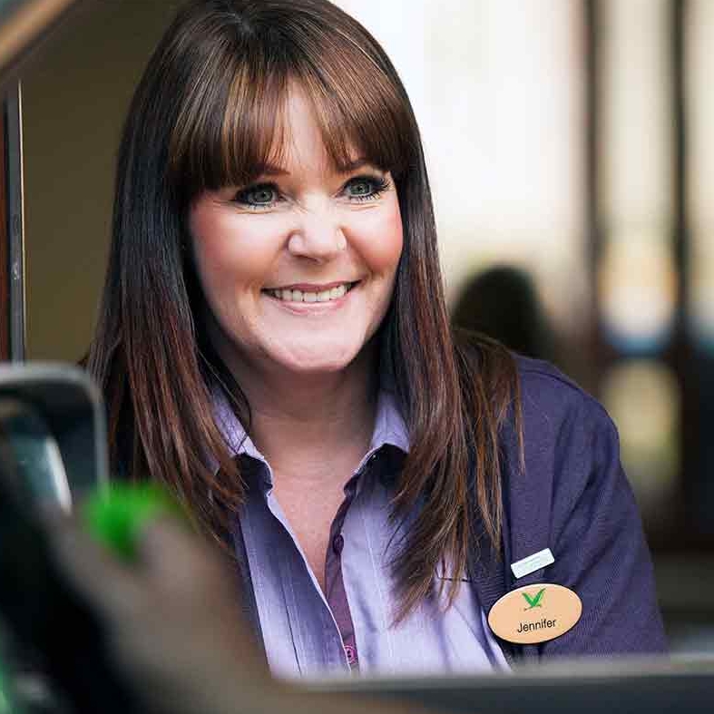A female staff member smiling