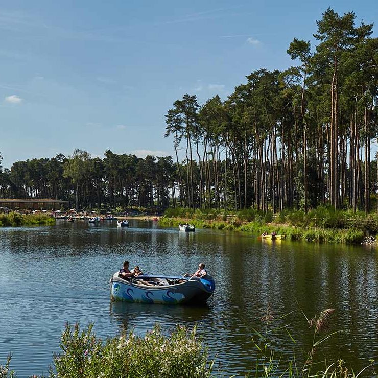 A family cruise along the lake in an Electric Boat at Woburn Forest