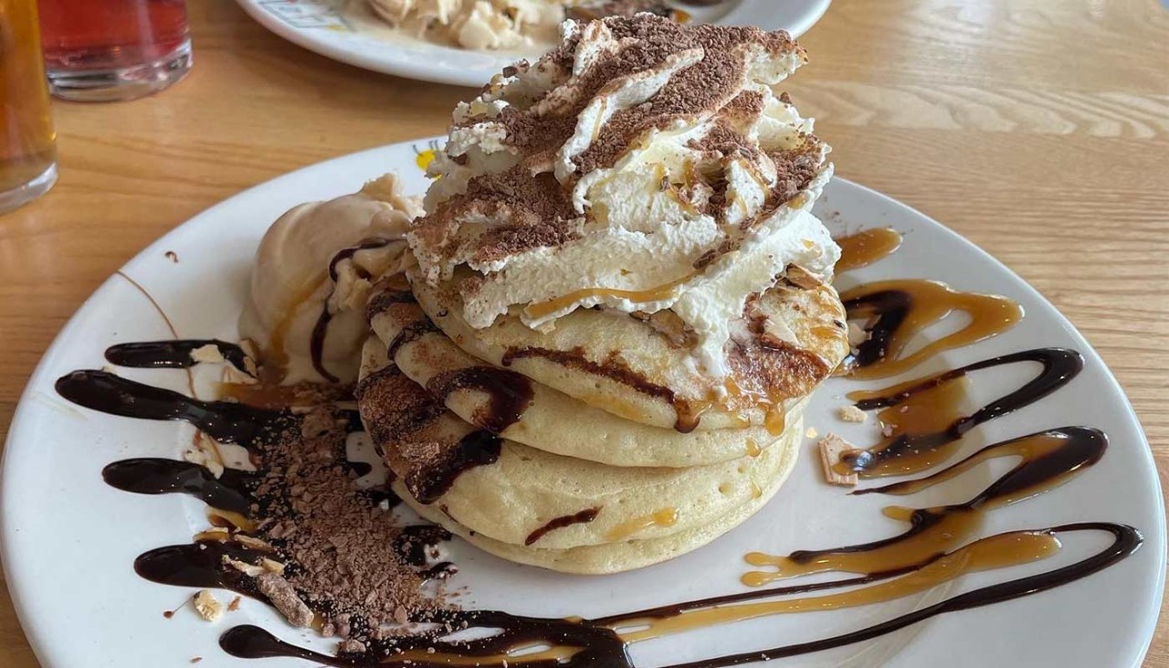 A pancake with cream and chocolate sauce 
