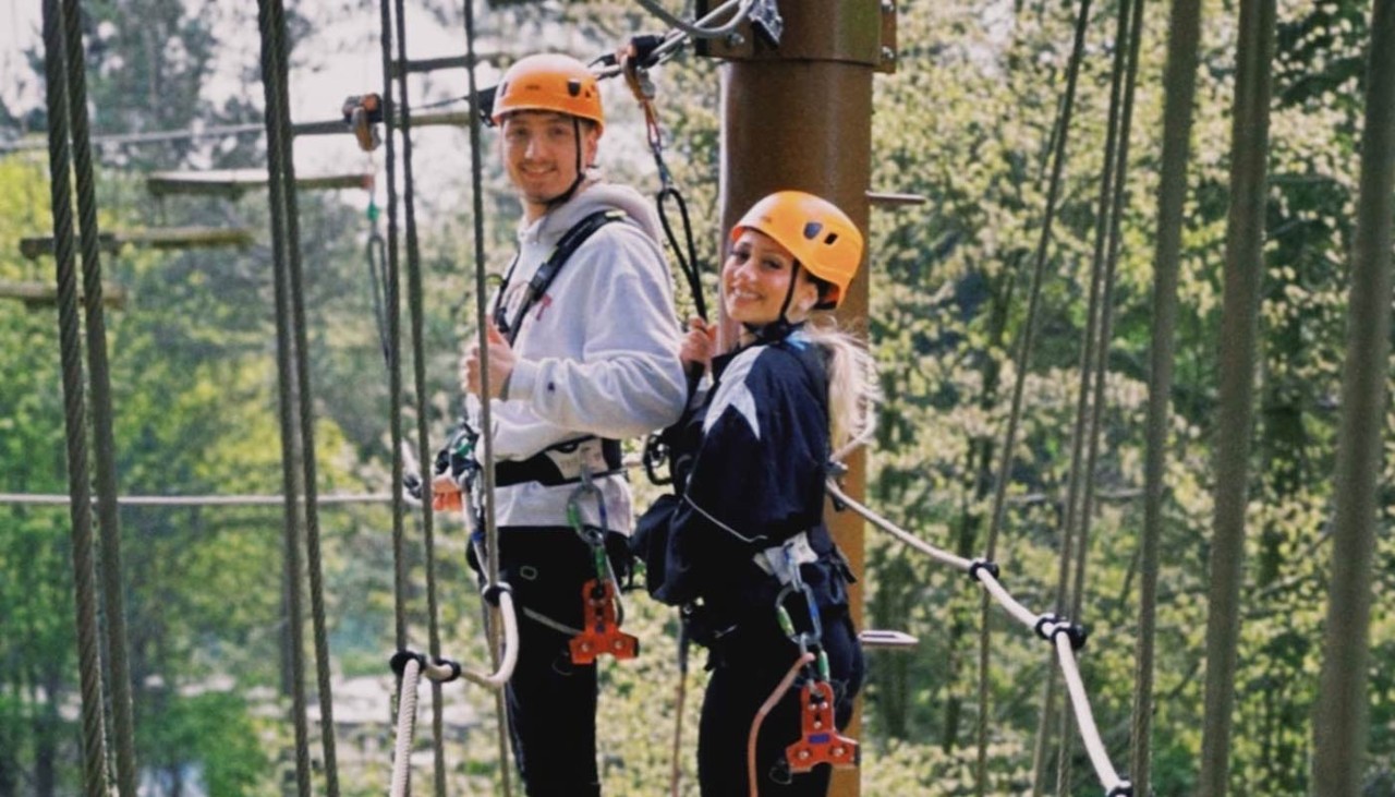 Couple standing on the Aerial Adventure 